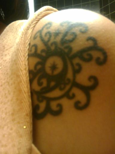 Left shoulder, sun, moon, stars intertwined